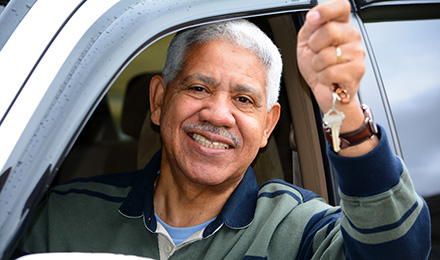 Elderly Driver holding keys while seated in car