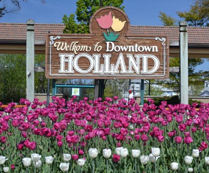 image of downtown Holland sign surrounded by tulips