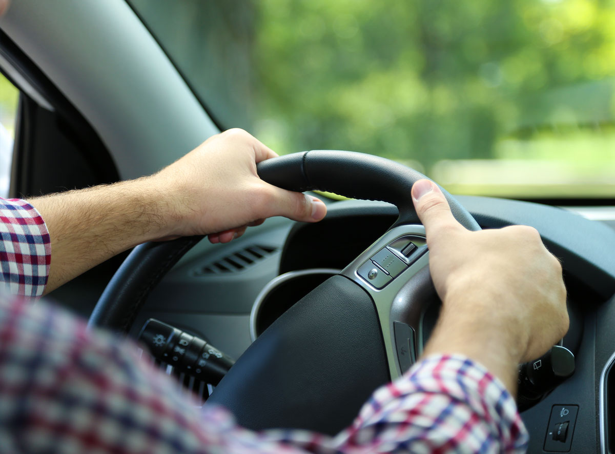 image of man driving vehicle