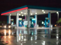 blurry image of gas station at night