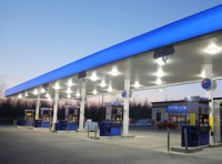 image of gas pumps at sunset