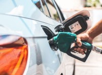 image of hand pumping gas with pump