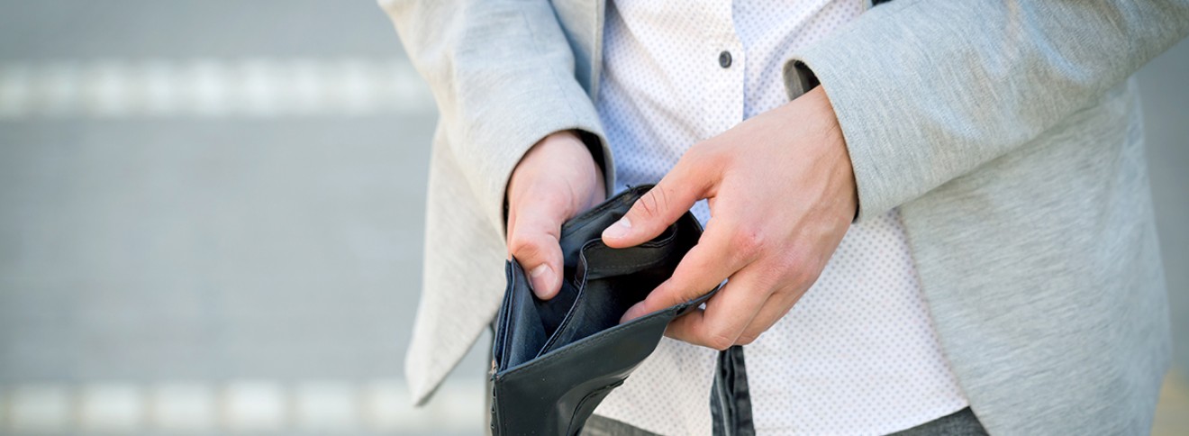 Man with empty wallet missing AAA membership card
