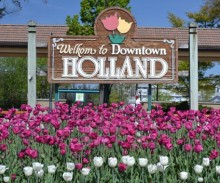 image of downtown Holland sign surrounded by tulips